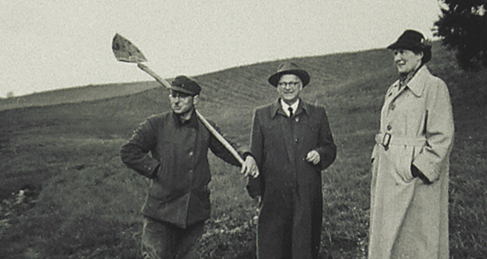 A picture of Dr. Hans Mueller inspecting the field with colleagues.